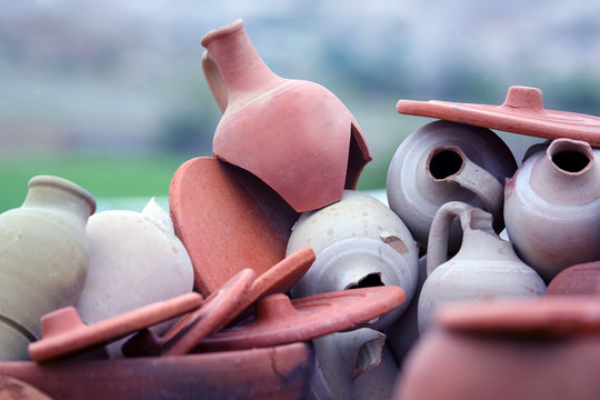 Set of stacked together broken clay pots