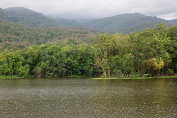 beautiful Reservoir with mountains Covered with fog

