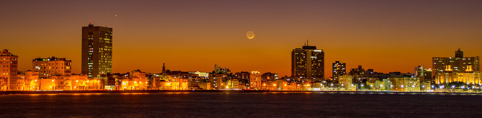 Fototapeta na wymiar Havana skyline at sunset, with crescent moon