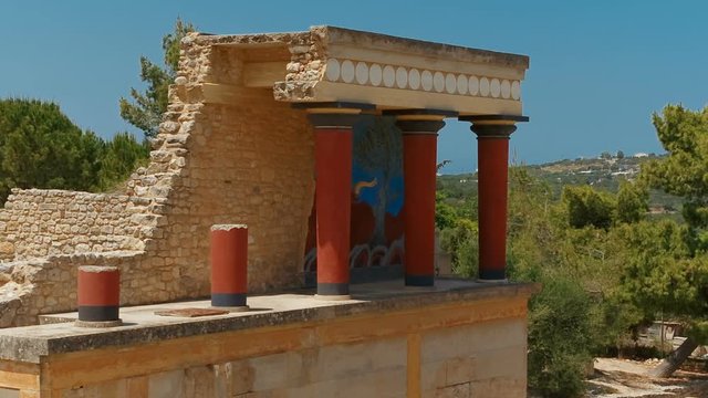 Establishing shot of the north entrance to the Minoan Palace of Knossos in Heraklion, Crete, Greece with the charging bull fresco