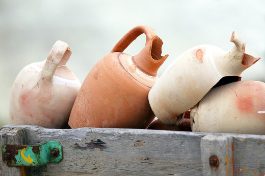 stacked together broken clay pots