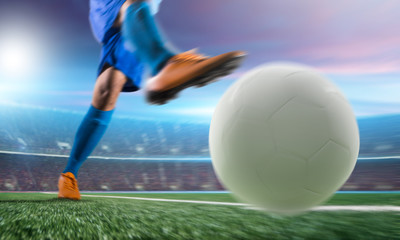 Naklejka premium Soccer player in action kick ball at stadium.