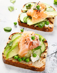 Toast with avocado, cucumber and  salmon
