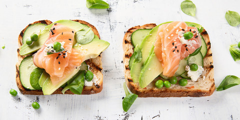 Toast with avocado, cucumber and  salmon