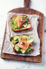 Toast with avocado, cucumber and  salmon