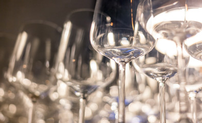 Empty glass glasses on the shelf, abstract background and texture, image with soft focus