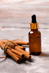 Cinnamon oil bottle and cinnamon sticks bundle