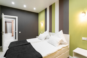 Hotel standart room. modern bedroom with white pillows. simple and stylish interior. interior lighting