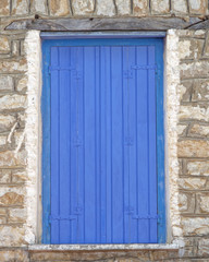 Obraz na płótnie Canvas Greece, vibrant blue door detail
