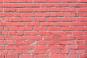 Old brick wall painted with pink color as background or texture