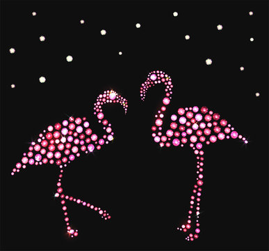 Two pink flamingos made with precious gems on black background