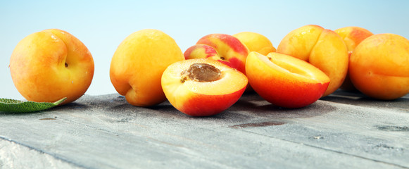 Delicious ripe apricots on wooden table. Fresh cut apricot fruits