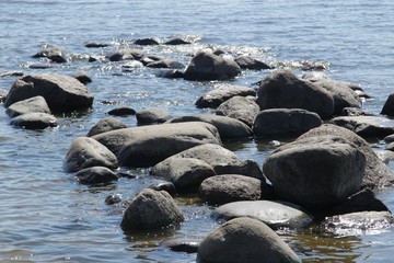 Stones on the beach. Stones near the water