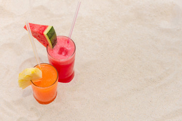 Fototapeta na wymiar Refreshing fruit smoothies drinks for summer at the beach