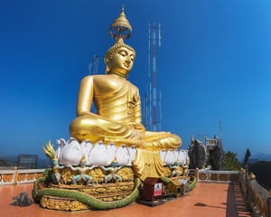 Sitting Buddha Statue at Tiger Cave Temple (Wat Tham Suea) on the top of a Mountain near Krabi Town, Krabi Province, Thailand