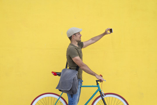 Trendy Man Taking A Selfie With His Fixed Bike