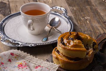 Tea with cinnamon Buns and raisin