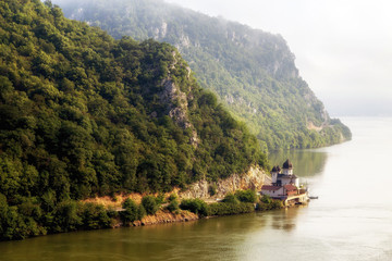 Fototapeta na wymiar Summer landscape of Danube Gorge, at the border between Romania and Serbia. Mraconia orthodox monastery 