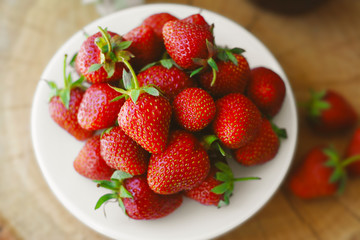Strawberry Jam and Fresh Strawberries Textured Cement Gray Wood Background and Jam Jar