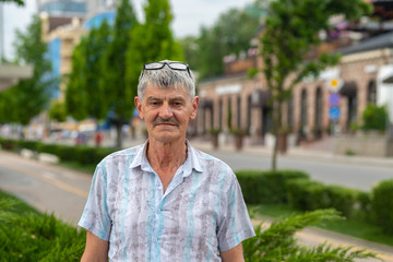 an elderly man walking around the city