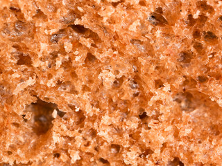 Bread with seeds and raisins as a background