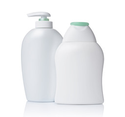 Blank white mockup dispenser and figured bottles of cosmetic products with green lid
