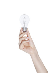 Female hand holding a light bulb on isolated background