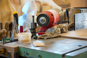 Carpenter tools on wooden table with sawdust