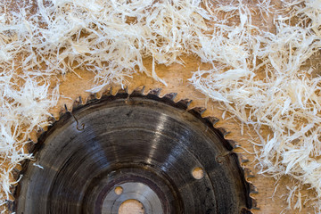 Carpenter tools on wooden table with sawdust. Circular Saw. Cutting a wooden plank