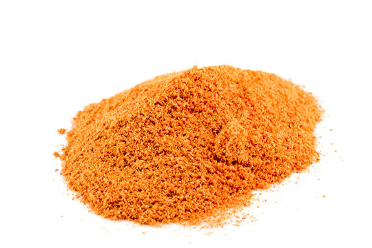 Cayenne pepper is a pile on a white background.