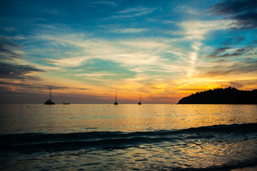 Naklejka na ściany i meble Sunset sky sea beach with boat