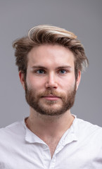 Obraz premium Portrait of a handsome young bearded man thinking