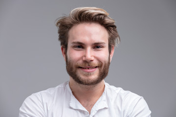 Obraz premium Portrait of a handsome blond young man smiling