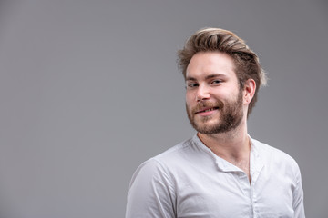 Attractive bearded man glancing back at camera