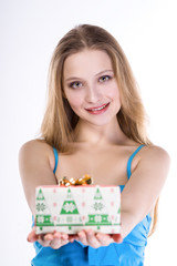 Surprised woman holding gift