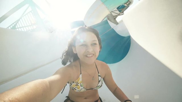 teen girl on a water slide