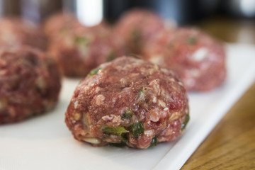 Making meatballs in a kitchen 