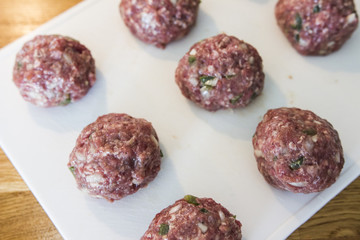 Making meatballs in a kitchen 