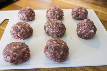 Making meatballs in a kitchen 