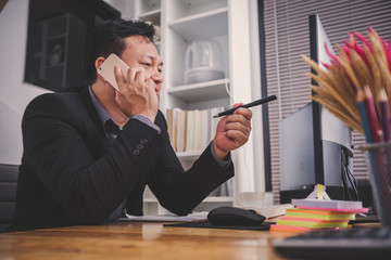Businessmen are sitting at the working space and review ideas and planning project to investment