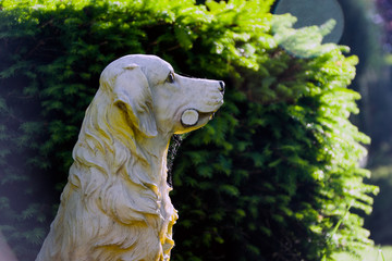 the sculpture of dog in the garden, Tula region, Russia