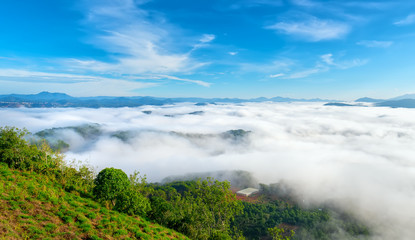 Landscape under morning fog covered the valley like clouds floating in wonderful idyllic highlands of Dalat, Vietnam