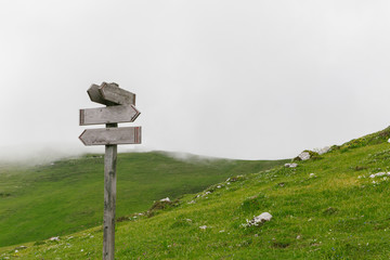 Signpost, empty direction sign in the mountains