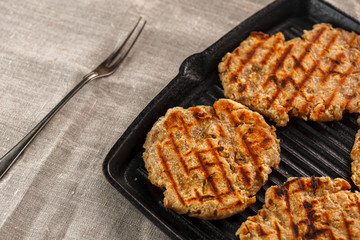 flat breads with cheese, onion and garlic on the grill