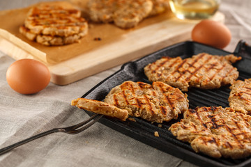 flat breads with cheese, onion and garlic on the grill