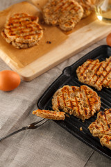 flat breads with cheese, onion and garlic on the grill