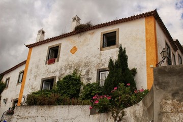 Narrow and colorful streets, facades and balconies of Obidos
