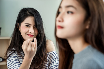 Asian lesbian couples are touchy among themselves. Woman are to reconcile her lover.