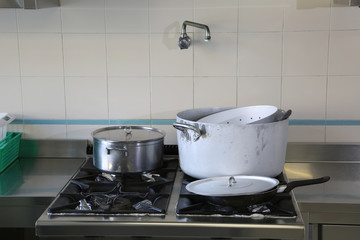 industrial cooker of a kitchen of a restaurant with pots