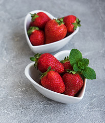 Bowls with fresh strawberries